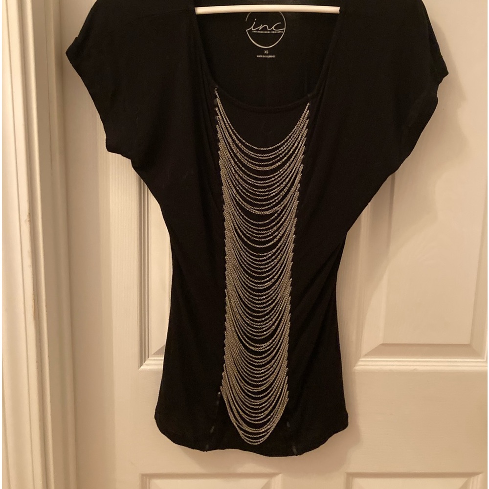 INC black top with small chains down the center